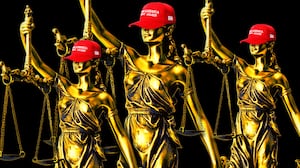 A photo illustration of Lady Justice wearing a MAGA hat.
