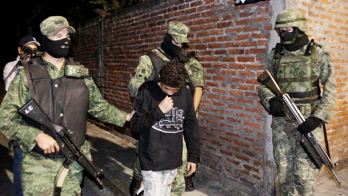 cheats/2011/07/27/teen-cartel-killer-jailed/el-ponchis-boy-arrest-cheat_bdgm4b