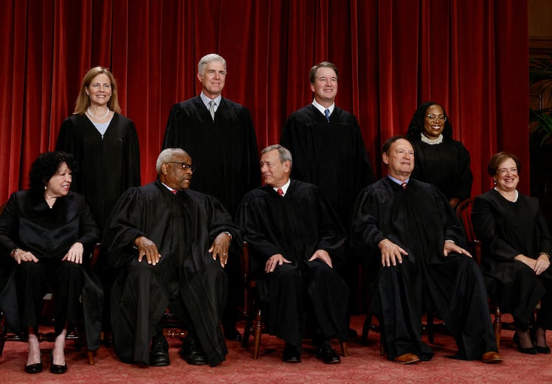 FILE PHOTO: U.S. Supreme Court justices pose for their group portrait at the Supreme Court in Washington, U.S., October 7, 2022. Seated (L-R): Justices Sonia Sotomayor, Clarence Thomas, Chief Justice John G. Roberts, Jr., Samuel A. Alito, Jr. and Elena Kagan. Standing (L-R): Justices Amy Coney Barrett, Neil M. Gorsuch, Brett M. Kavanaugh and Ketanji Brown Jackson. REUTERS/Evelyn Hockstein/File Photo