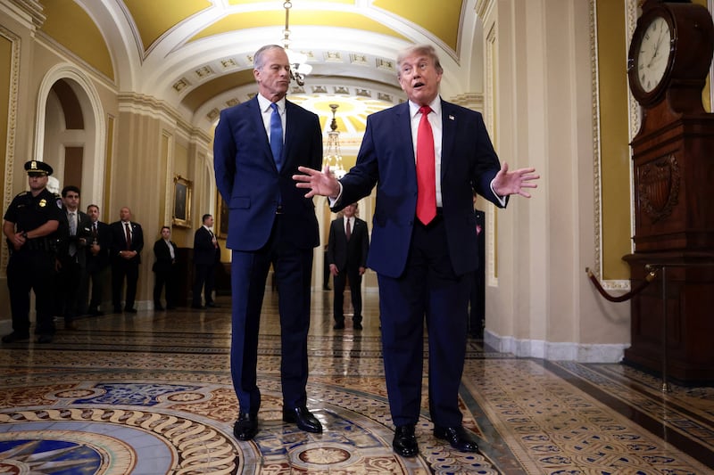 U.S. President Donald Trump speaks with the media as he walks with Senate Majority Leader John Thune (R-SD), to the Senate Republican Steering Committee lunch at the U.S. Capitol, in Washington, D.C., U.S., June 24, 2026. REUTERS/Evelyn Hockstein