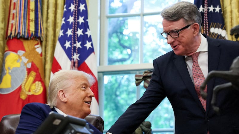 U.S. President Donald Trump shakes hands with Britain's ambassador to the United States, Peter Mandelson, after announcing a trade deal with the U.K., in the Oval Office at the White House in Washington, D.C., U.S., May 8, 2025. REUTERS/Leah Millis