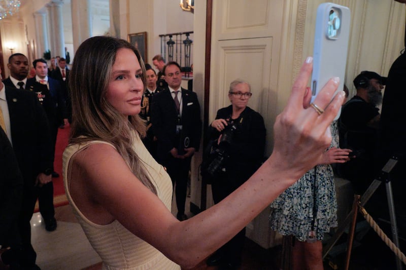 WASHINGTON, DC - JUNE 26: White House Communications Advisor Margo Martin shoots a video of President Donald Trump during a "One, Big, Beautiful" event in the East Room of the White House on June 26, 2025 in Washington, DC. Trump held an event to urge the passage of the "One, Big, Beautiful Bill," Trump's signature tax-and-spending agenda. (Photo by Chip Somodevilla/Getty Images)