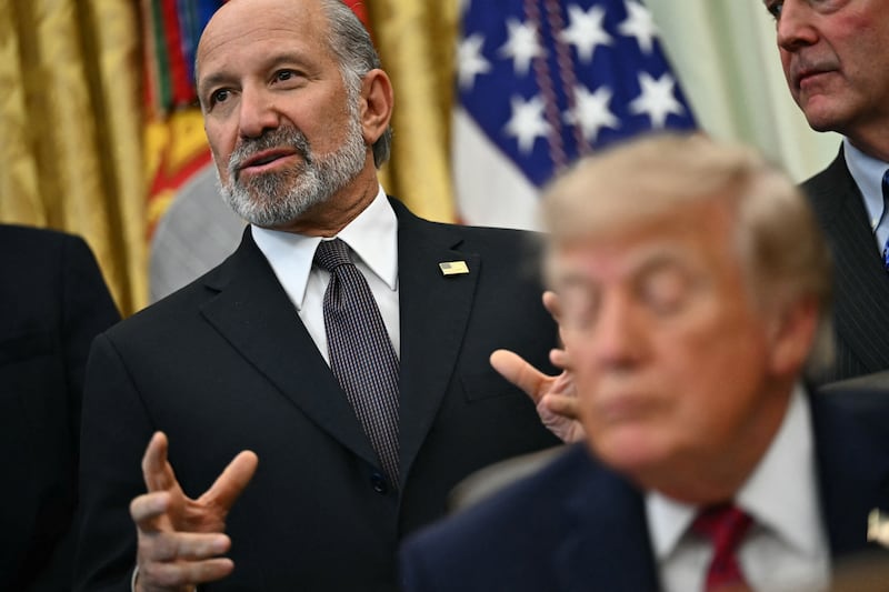 President Donald Trump listens to Commerce Secretary Howard Lutnick in the White House Oval Office in September 2026.