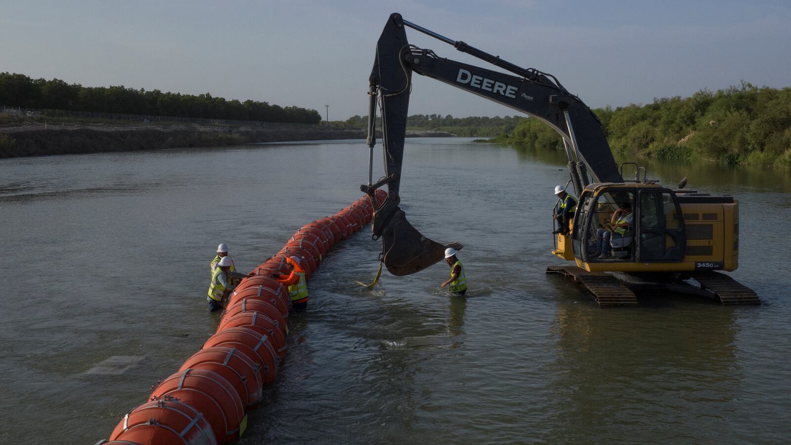 A chain of buoys sits on the Rio Grande river between the U.S. and Mexico.