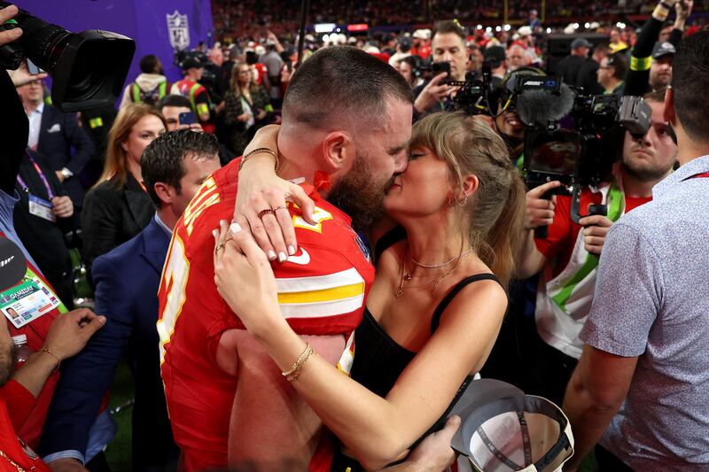 Travis Kelce and Taylor Swift embrace after Super Bowl LVIII on February 11, 2024