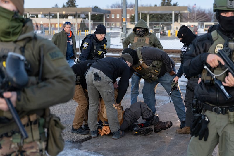 MINNEAPOLIS, UNITED STATES - JANUARY 09: Federal agents arrest a protestor outside an ICE facility after he allegedly attempted to block a vehicle during a protest against U.S. Immigration and Customs Enforcement (ICE), in Minneapolis, MN, United States, on January 9, 2026. (Photo by Mostafa Bassim/Anadolu via Getty Images)