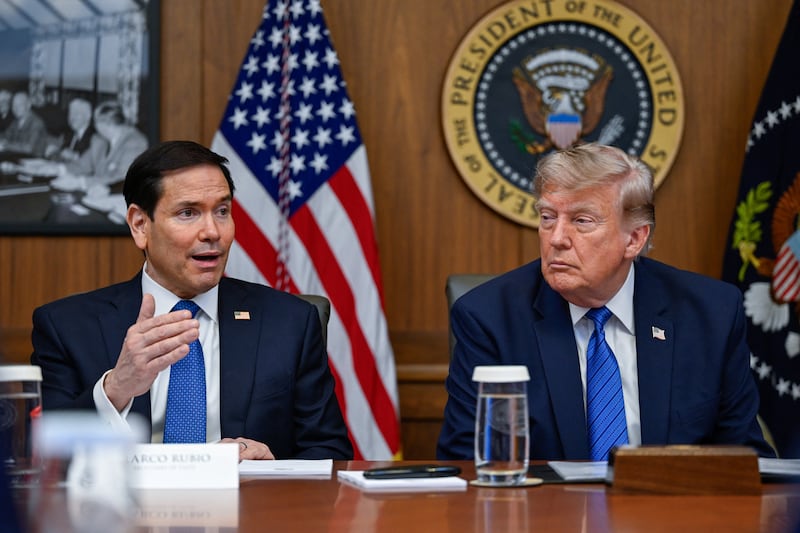 Donald Trump and Marco Rubio at a cabinet meeting at Camp David.