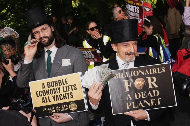 Costumed demonstrators participate in a “Resistance Red Carpet” protest against the Met Gala, the star-studded fundraiser known for its extravagant fashion and high-profile guests, in New York City, U.S., May 4, 2026.