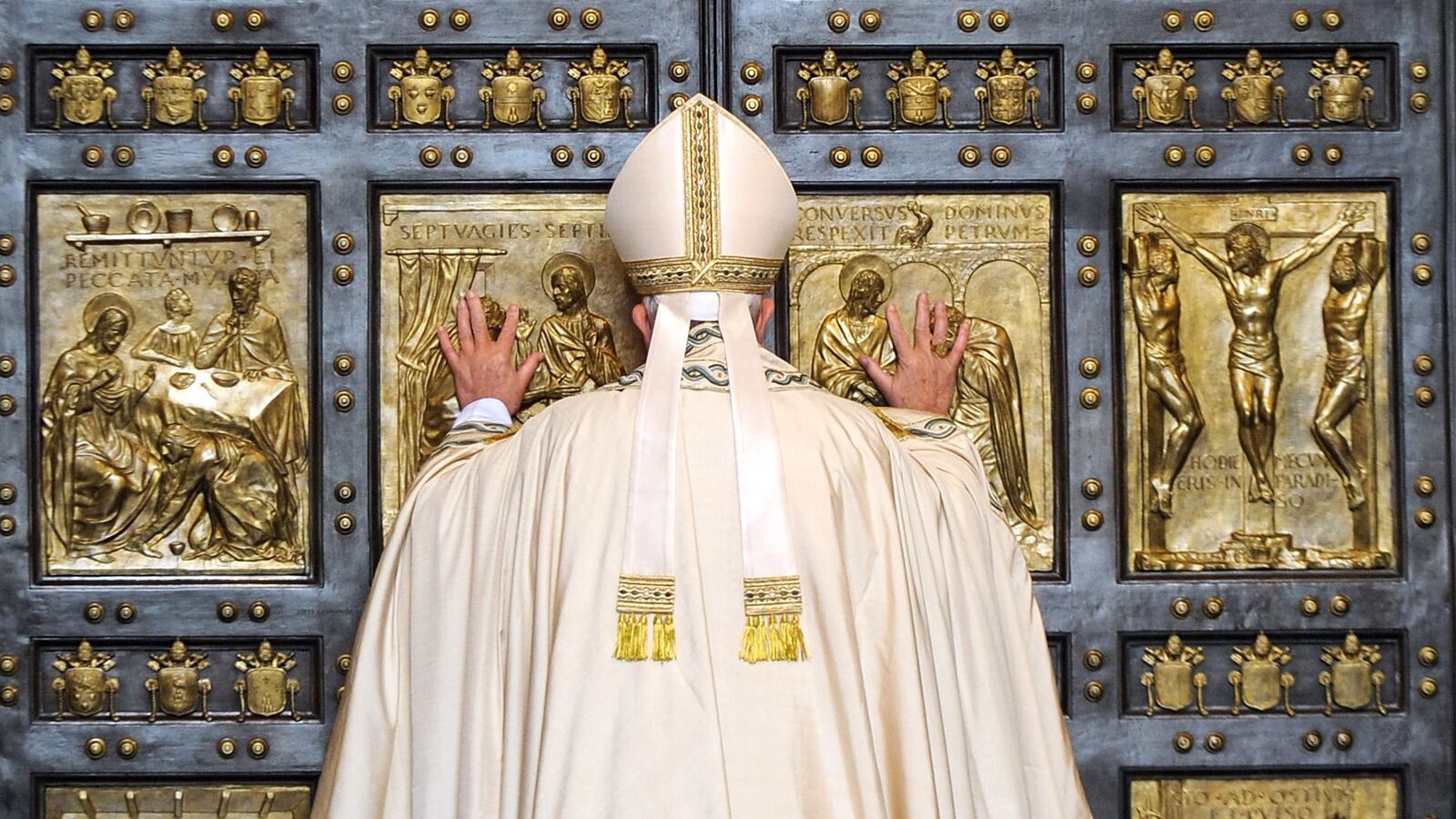 Pope Francis opens the Holy Door of St. Peter's Basilica on December 8, 2015 in Vatican City, Vatican. During the solemnity of the Immaculate Conception of the Blessed Virgin Mary, Pope Francis solemnly inaugurated the Jubilee Year of Mercy with the celebration of the Holy Sacrifice of the Mass. This Extraordinary Holy Year is itself a gift of grace,' the Pope said in his homily. (Photo by Vatican Pool/Getty Images)