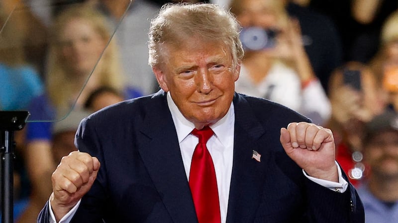U.S. President Donald Trump dances, as he delivers remarks on the economy, at the General Motors Proving Ground in Milford, Michigan, U.S. July 27, 2026.