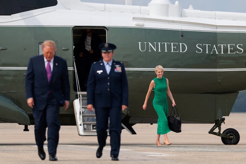 President Donald Trump's executive assistant Natalie Harp disembarks Marine One to board Air Force One, en route to Houston, Texas, at Joint Base Andrews, Maryland, on Aug. 27, 2026.
