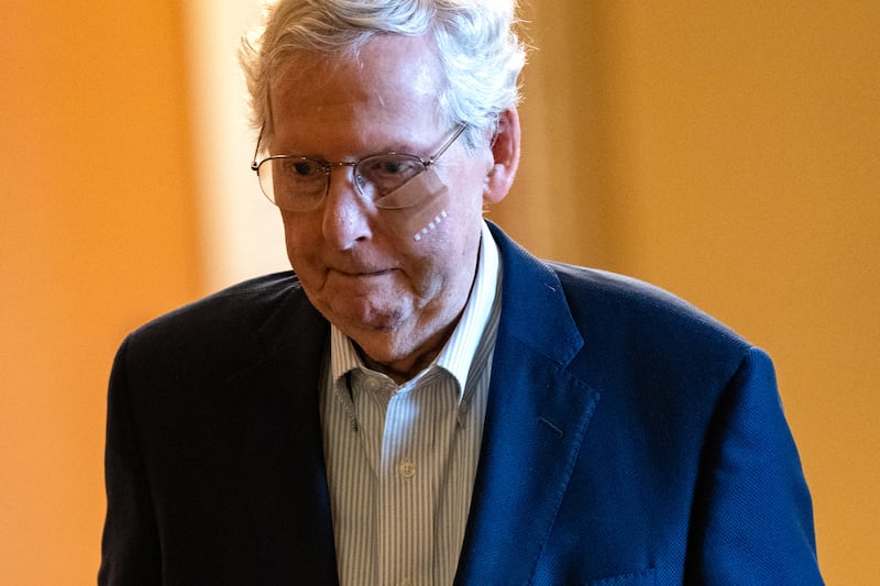 Then-Senate Minority Leader Mitch McConnell is assisted by staff as he goes to the Senate Chamber to vote on December 11, 2024 in Washington, DC. According to a statement released by his office, the Kentucky Republican fell after tripping following a lunch, spraining his wrist and sustaining a minor cut to his face. The incident is the latest in a high-profile string of health issues for the 82-year-old senator.