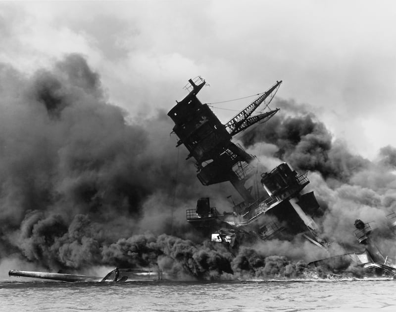 The forward superstructure of the sunken battleship USS Arizona burns after the Japanese raid on Pearl Harbor, December 7, 1941. The 75th anniversary of the attack, which brought the United States into World War Two, is marked on December 7, 2016   U.S. Navy/U.S. Naval History and Heritage Command/Handout via Reuters ATTENTION EDITORS - THIS IMAGE WAS PROVIDED BY A THIRD PARTY. EDITORIAL USE ONLY.