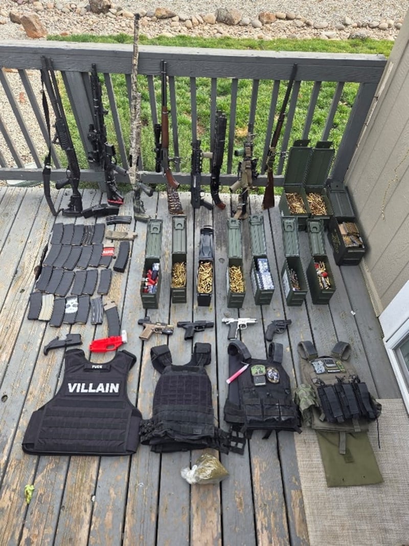 A cache of firearms, ammunition, and body armor found at Kamfolt's property.