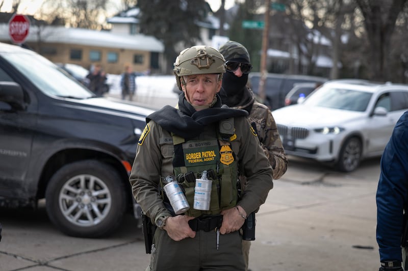 Border Patrol Chief Gregory Bovino watches as agents take people into custody at a gas station on January 11, 2026 in St. Paul, Minnesota.