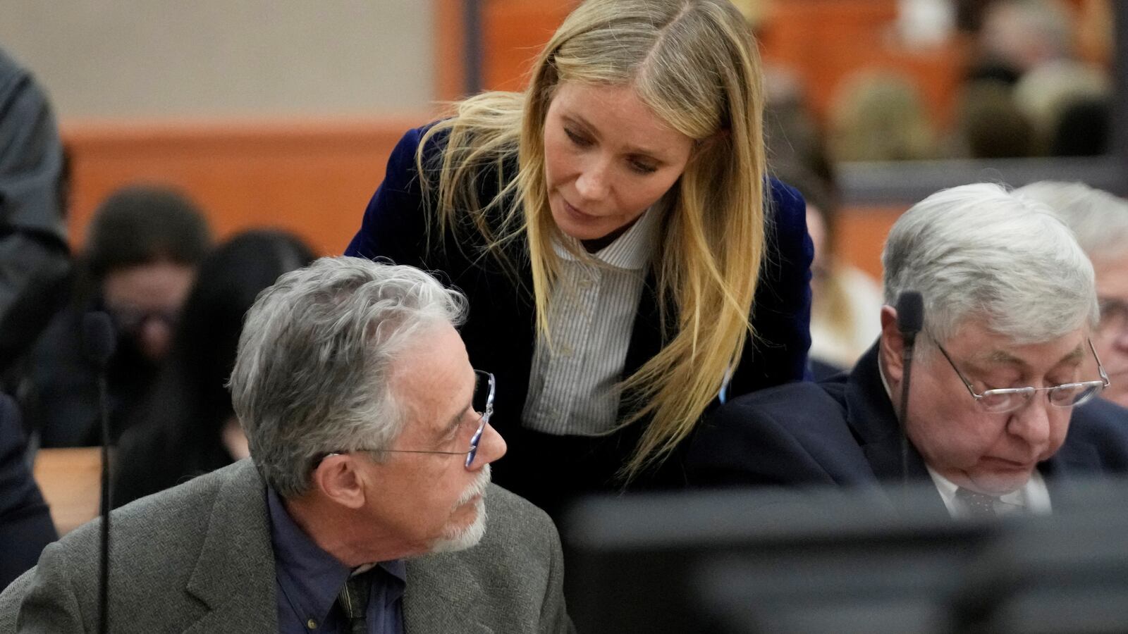 Gwyneth Paltrow speaks with retired optometrist Terry Sanderson as she walks out of the courtroom following the reading of the verdict.