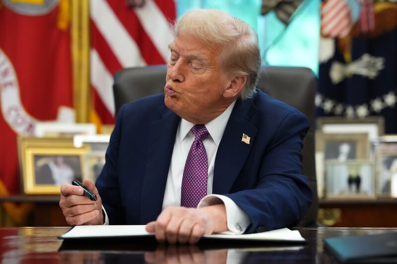WASHINGTON, DC - SEPTEMBER 05: U.S. President Donald Trump signs executive orders during a press availability in the Oval Office of the White House on September 05, 2025 in Washington, DC. President Trump signed executive orders which included the renaming of the Department of Defense to the Department of War. (Photo by Kevin Dietsch/Getty Images)