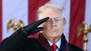 President Donald Trump salutes at the conclusion of a Veterans Day ceremony at Arlington National Cemetery in Arlington, Virginia on November 11, 2025.