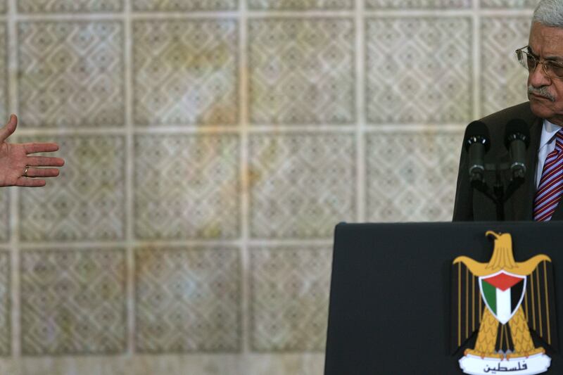 articles/2012/06/08/america-s-iconsequential-anger/bush-hand-abbas-openz_dilpks