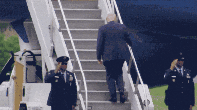 Donald Trump stumbles while climbing the stairs to board Air Force One.