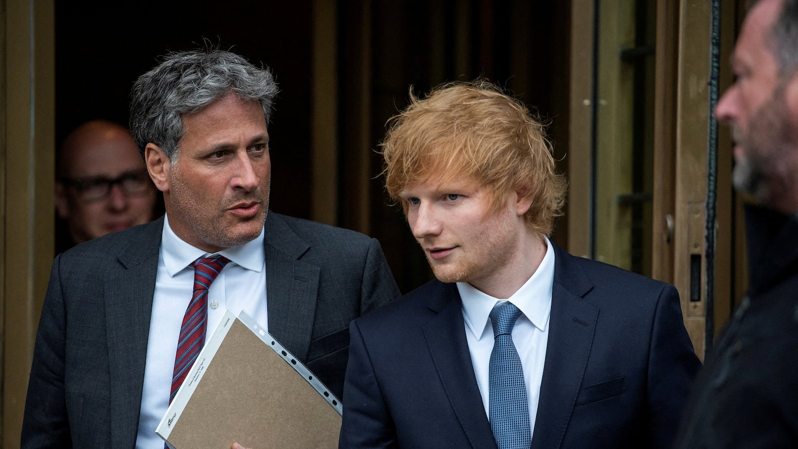 Singer Ed Sheeran exits the Manhattan federal court for his copyright trial.