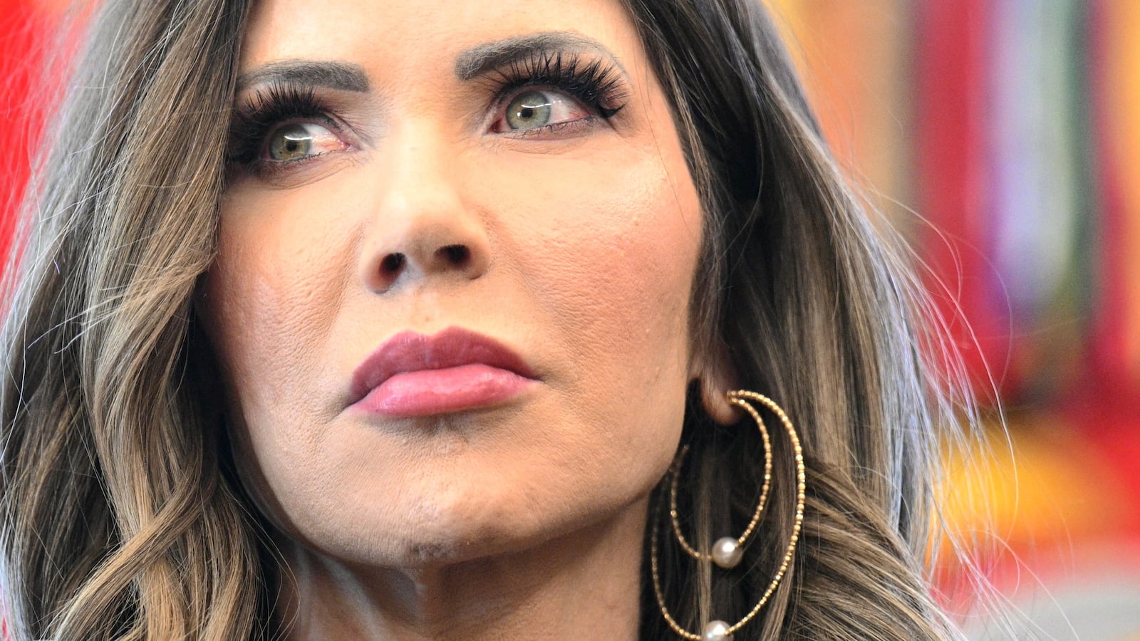 US Secretary of Homeland Security Kristi Noem looks on during a meeting with the White House Task Force on the FIFA World Cup 2026 in the Oval Office