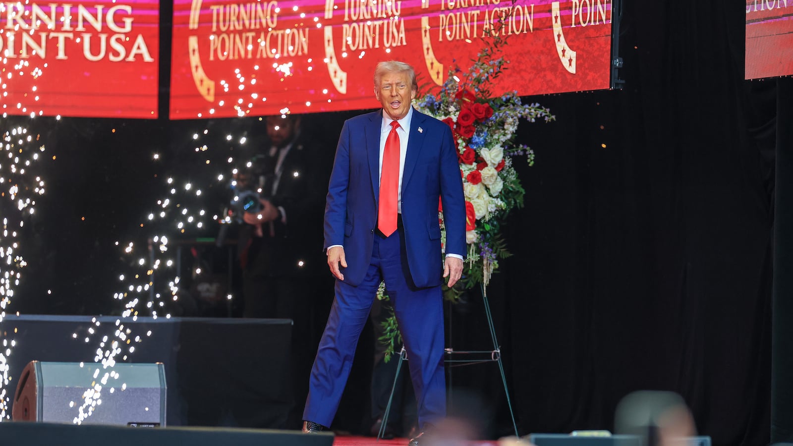 GLENDALE, ARIZONA - SEPTEMBER 21: U.S. President Donald Trump walks onstage during the memorial service for political activist Charlie Kirk at State Farm Stadium on September 21, 2025 in Glendale, Arizona. Kirk, the CEO and co-founder of Turning Point USA, was shot and killed on September 10th while speaking at an event during his "American Comeback Tour" at Utah Valley University. (Photo by Joe Raedle/Getty Images)
