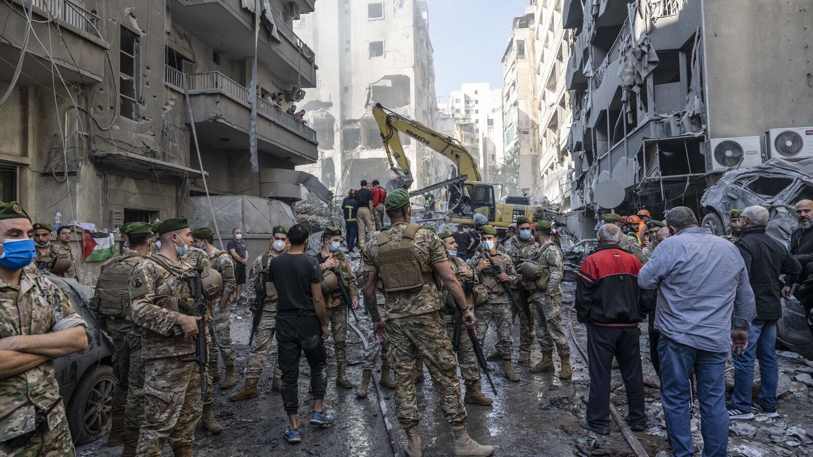 Soldiers join a search-and-rescue operation after the latest Israeli air strike on Beirut.