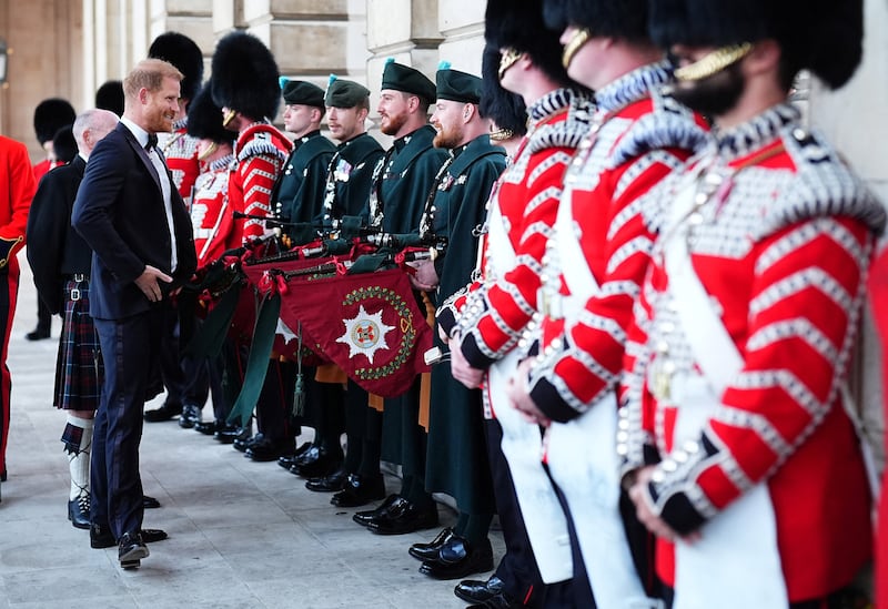 Britain's Prince Harry, Duke of Sussex, speaks to members of the Irish Guards' Band as he arrives at the inaugural Invictus Spirit Awards, presented by ATCO, held at Old Royal Naval College at Greenwich, in London, Britain, September 17, 2026. Aaron Chown/Pool via REUTERS
