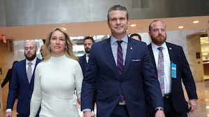 Pete Hegseth, U.S. President-elect Donald Trump's nominee for Secretary of Defense, and his wife Jennifer Rauchet arrive for a meeting at the Hart Senate Office Building.