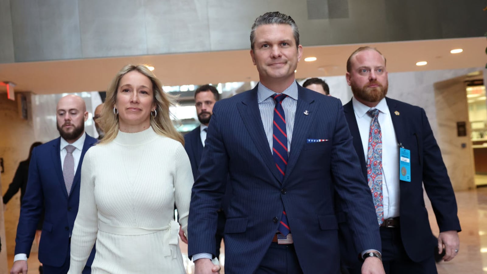 Pete Hegseth, U.S. President-elect Donald Trump's nominee for Secretary of Defense, and his wife Jennifer Rauchet arrive for a meeting at the Hart Senate Office Building.