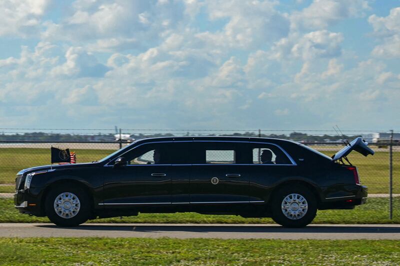 The US President's official vehicle known as "The Beast", drives with its trunk open, as US President Donald Trump's motorcade travels to Palm Beach International Airport in West Palm Beach, Florida, on November 9, 2025. Trump is returning to Washington DC after spending part of the weekend at his Florida residence of Mar-a-Lago. (Photo by Jim WATSON / AFP) (Photo by JIM WATSON/AFP via Getty Images)