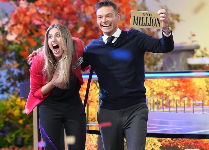 Wheel of Fortune contestant Christina Derevjanik and host Ryan Seacrest.
