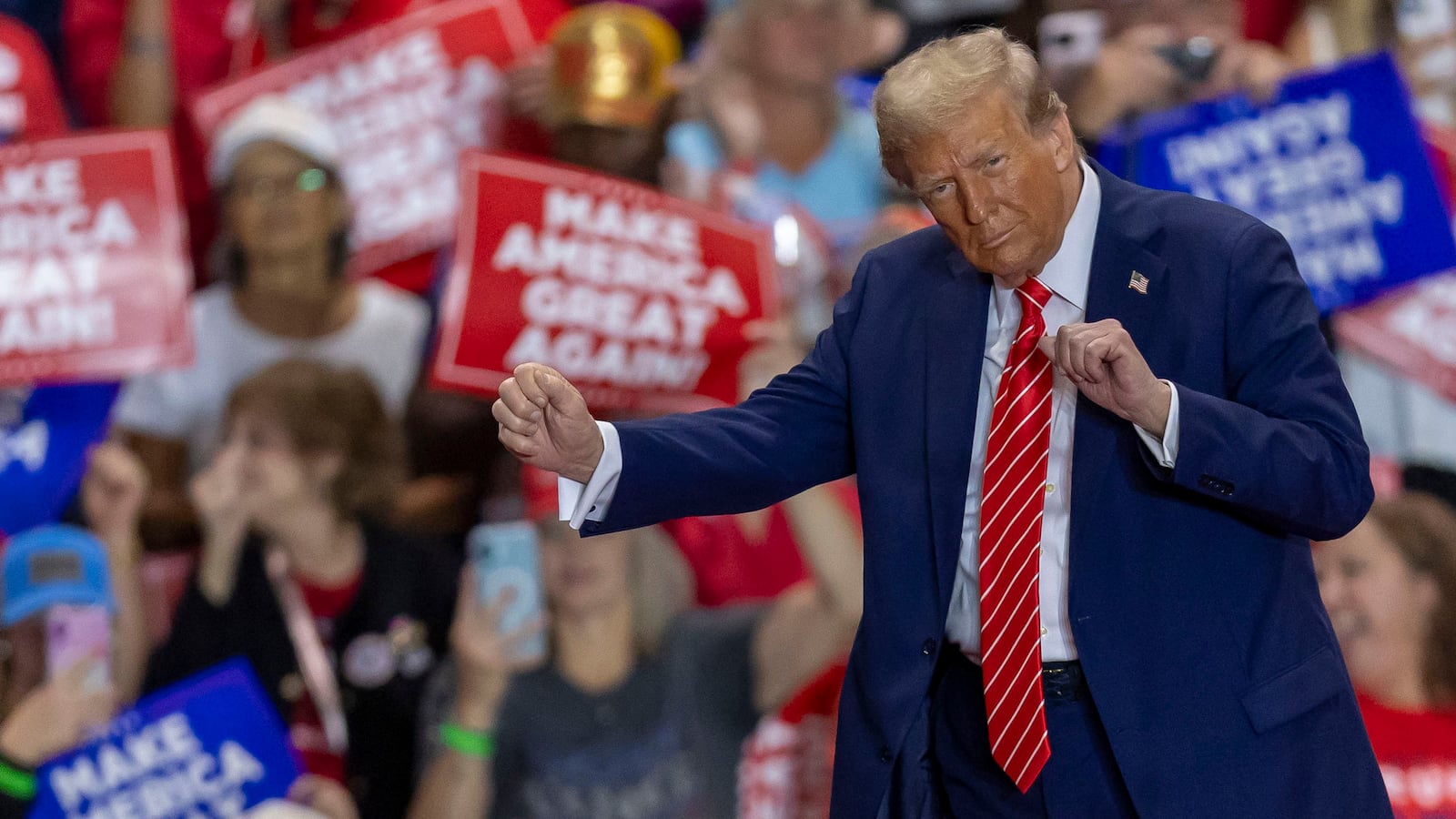 Republican presidential nominee former President Donald Trump shows off his dance moves to "YMCA" following his remarks on Wednesday, Oct. 30, 2024, at the Rocky Mount Event Center in Rocky Mount, North Carolina.