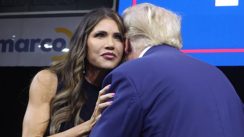 RAPID CITY, SOUTH DAKOTA - SEPTEMBER 08: Republican presidential candidate former President Donald Trump greets South Dakota Governor Kristi Noem after she introduced him at the Monument Leaders Rally hosted by the South Dakota Republican Party on September 08, 2023 in Rapid City, South Dakota. Noem endorsed Trump during the event.