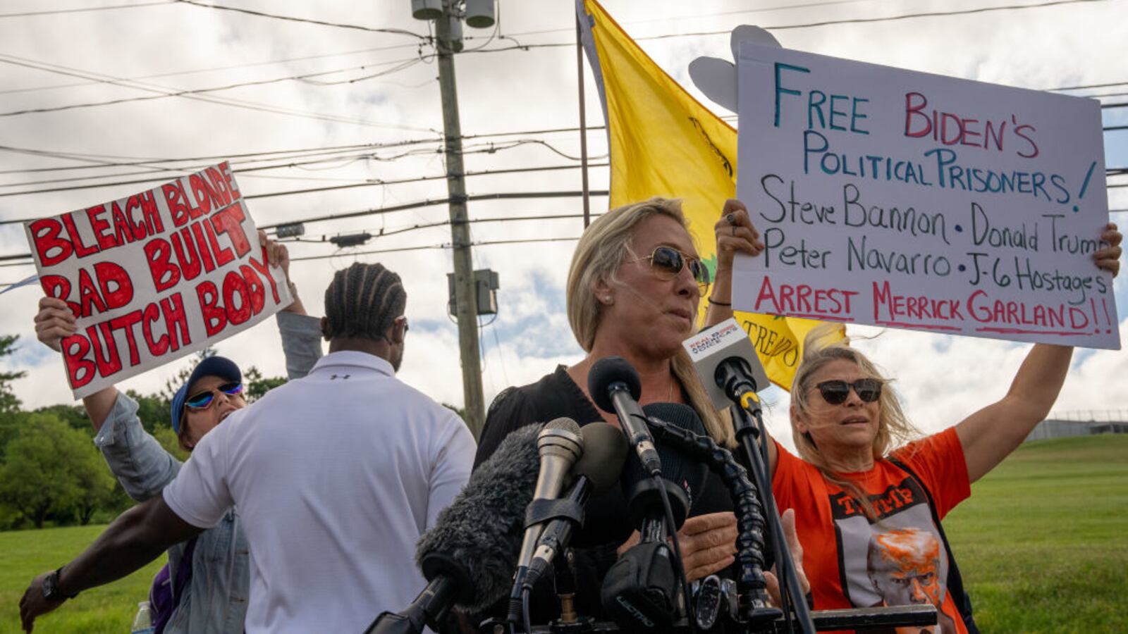 Rep. Marjorie Taylor Greene speaks outside the prison where Steve Bannon turned himself in.