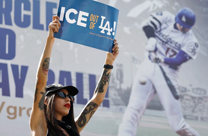 A protester demonstrates near Dodger Stadium during a protest against the Los Angeles Dodgers organization and ICE immigration raids on June 21, 2025 in Los Angeles, California.