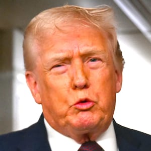 Donald Trump speaks to the press aboard Air Force One on January 11, 2026.