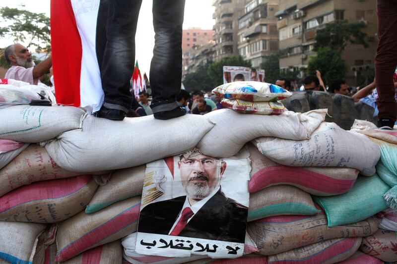 galleries/2013/08/09/week-in-photos-august-9-photos/130809-wip-morsi-supporters-cairo_aus48l