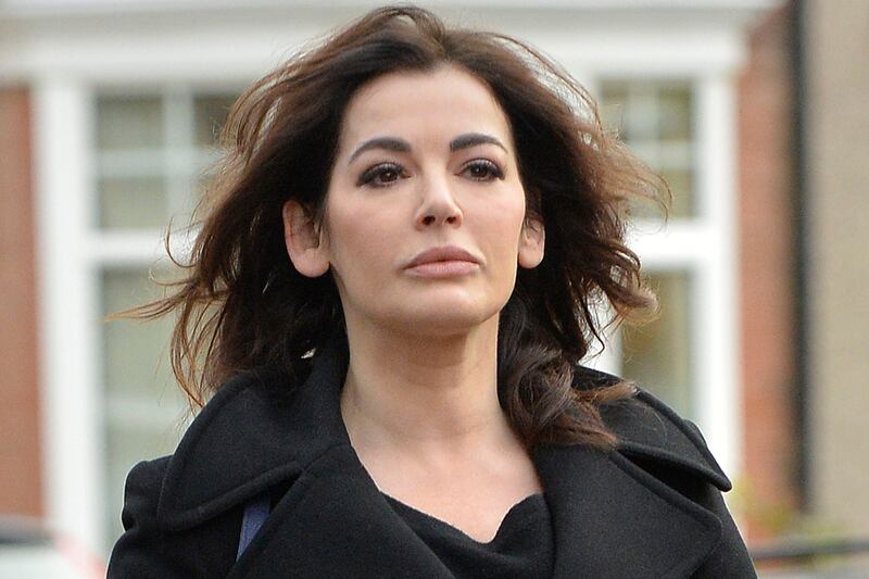 articles/2014/06/30/saatchi-website-sells-pictures-of-him-throttling-nigella/140403-nigella-cheat_qkj2zn
