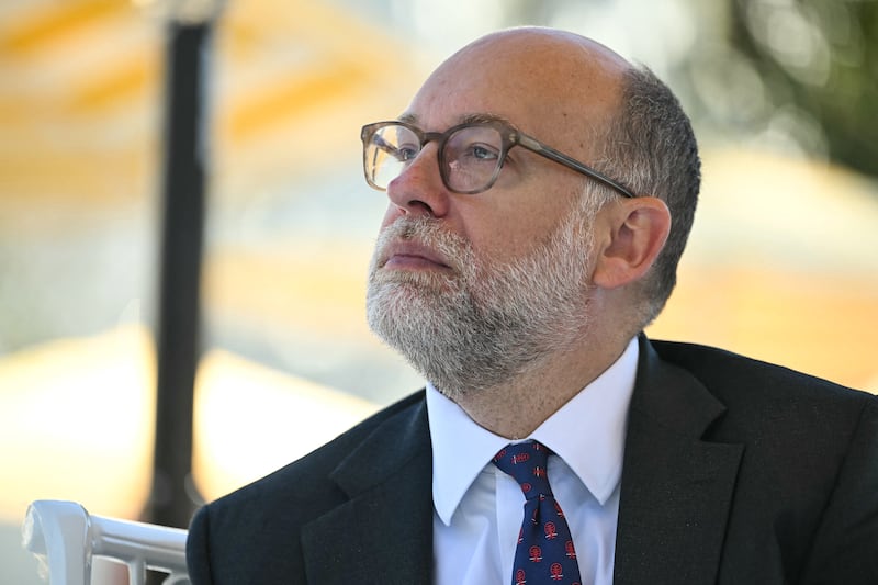 Director of the Office of Management and Budget (OMB) Russell Vought listens as President Donald Trump speaks at a "Rose Garden Club" lunch in the Rose Garden of the White House in Washington, DC, on October 21, 2025.