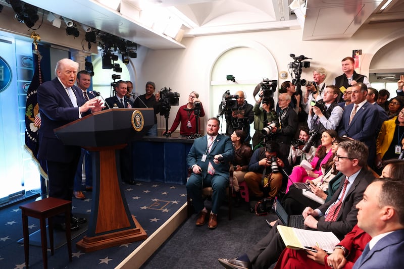 U.S. President Donald Trump speaks, flanked by Secretary of Defense Pete Hegseth and Chairman of the Joint Chiefs of Staff Gen. Dan Caine, during a press conference in the James S. Brady Press Briefing Room at the White House in Washington, D.C., U.S., April 6, 2026. REUTERS/Kevin Lamarque