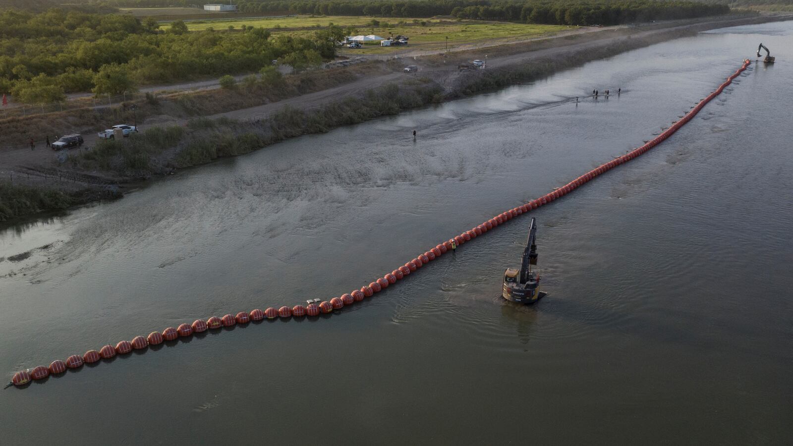 Texas must remove the floating barriers it installed in the Rio Grande River as a deterrent for migrants, a federal judge ruled Wednesday.