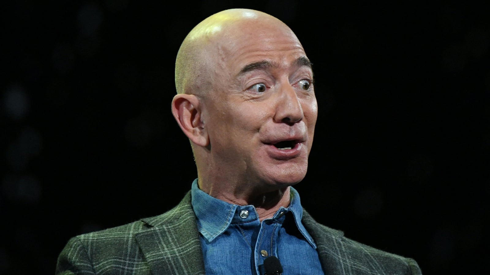 Jeff Bezos addresses the audience during a keynote session at the Amazon Re:MARS conference on robotics and artificial intelligence at the Aria Hotel in Las Vegas, Nevada on June 6, 2019.