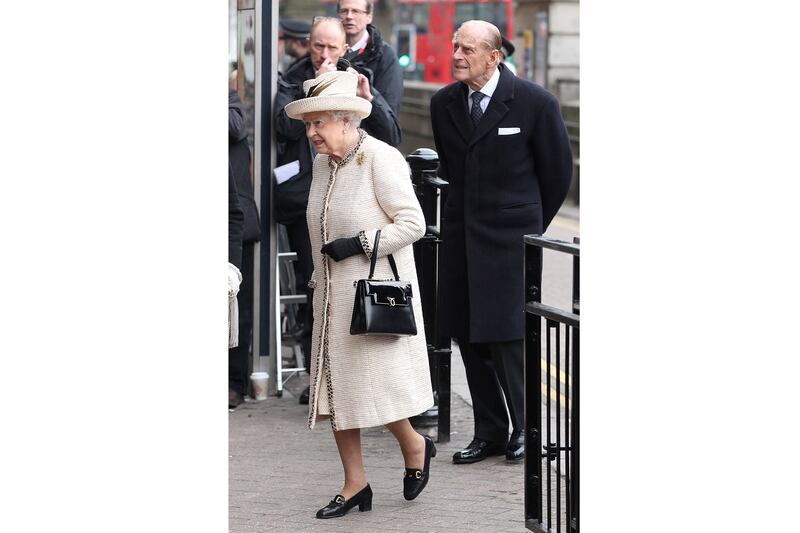 articles/2013/03/20/kate-middleton-wears-baby-on-board-button-as-she-takes-subway-with-queen/130320-sykes-queen-duchness-underground-2_wajqtr