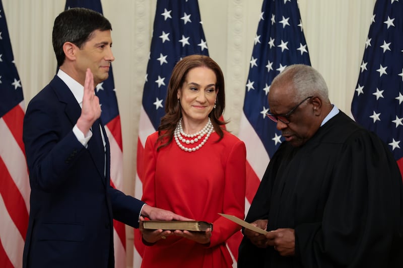 WASHINGTON, DC - MAY 22: Kevin Warsh (L) takes the oath of office from U.S. Supreme Court Associate Justice Clarence Thomas (R) as his wife Jane Lauder looks on during his swearing-in ceremony to be the new Chairman of the Federal Reserve in the East Room of the White House on May 22, 2026 in Washington, DC. Warsh succeeds Jerome Powell, who served as Chair for eight years. (Photo by Anna Moneymaker/Getty Images)