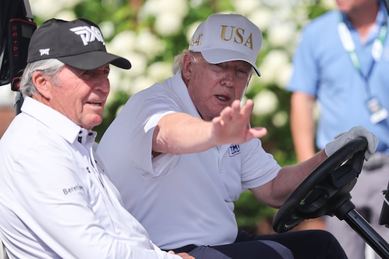 President Donald Trump drives in a golf cart with Gary Player at Bedminster before the forth round of LIV Golf New York on August 9, 2026 at Trump National Golf Club in Bedminster, New Jersey.