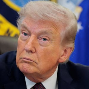 U.S. President Donald Trump attends to sign an executive order in the Oval Office of the White House in Washington, D.C., March 31, 2026.  REUTERS/Evan Vucci
