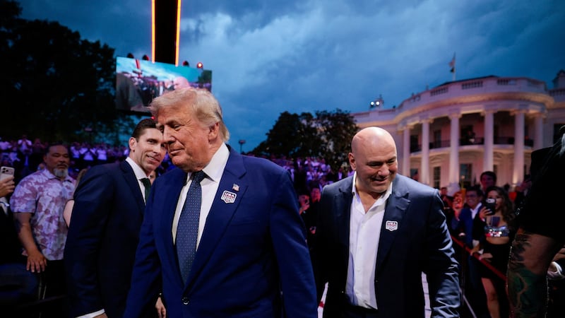 U.S. President Donald Trump arrives with UFC CEO Dana White for UFC Freedom 250 on the South Lawn of the White House in Washington, D.C., U.S., June 14, 2026. REUTERS/ Evan Vucci