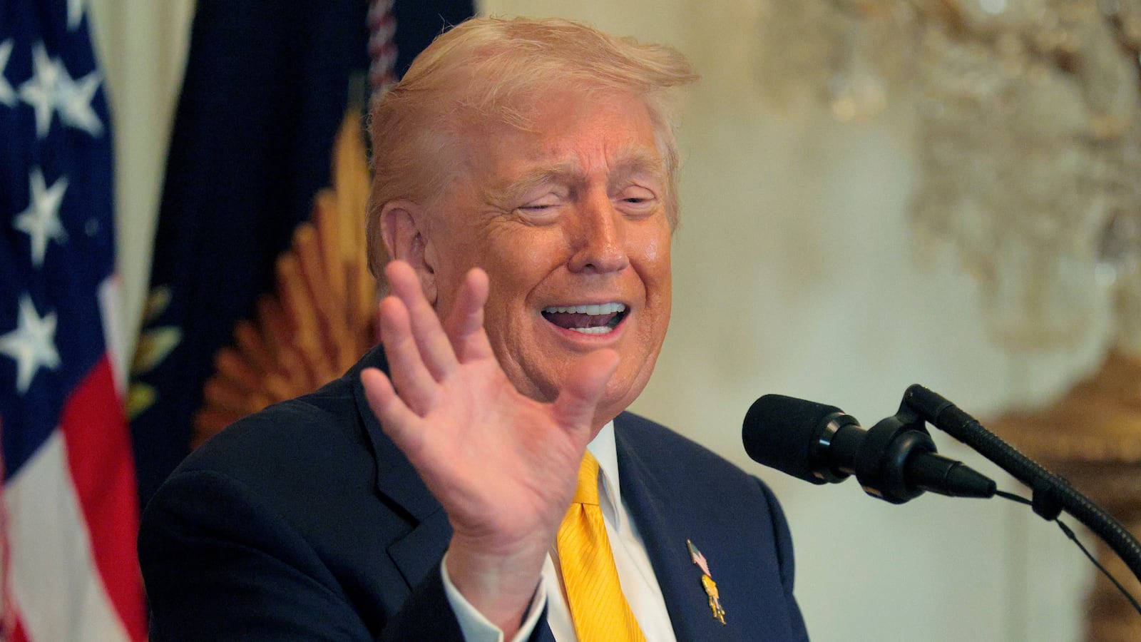 President Donald Trump talks about Nicki Minaj's "beautiful" skin and long nails at a Black History Month reception in the East Room of the White House on February 18, 2026.